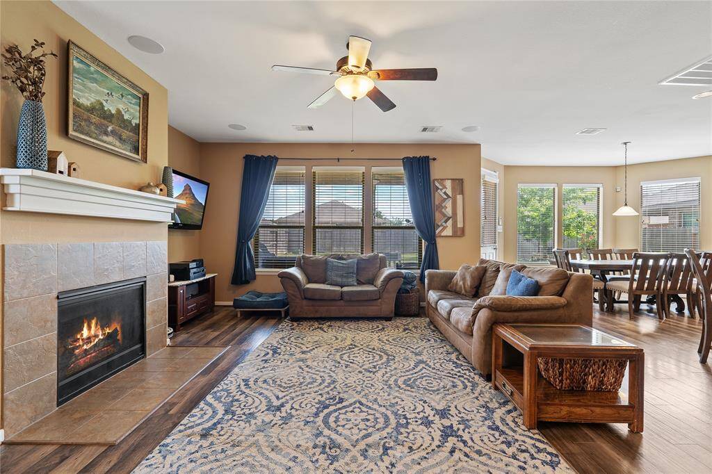 Living room with tons of natural light and gas log fireplace