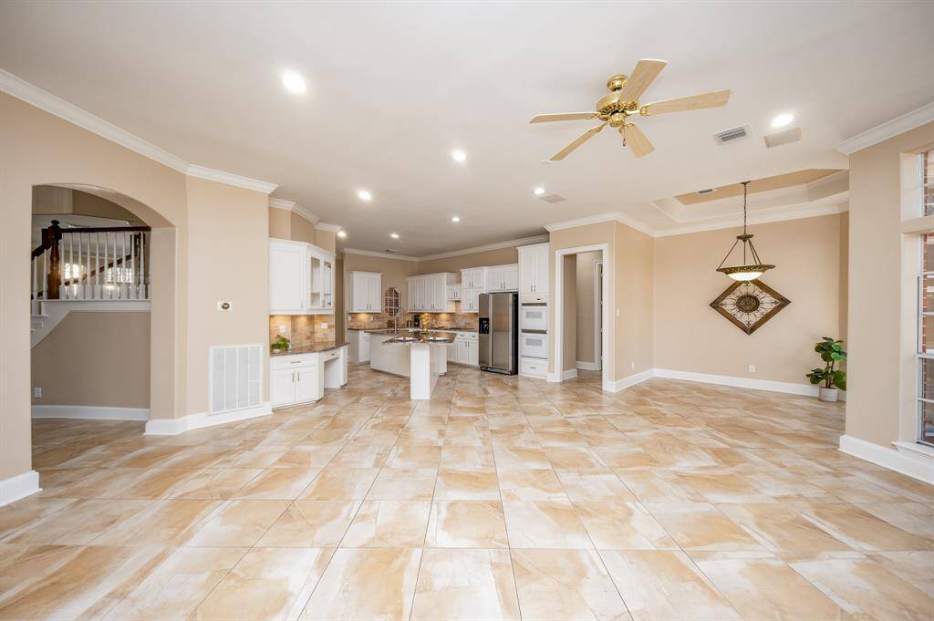 This tremendous shared living/kitchen space will be home to many memorable gatherings!