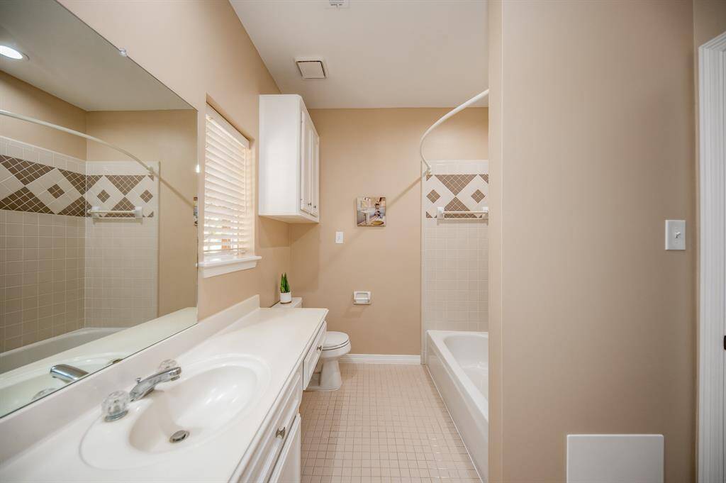 A secondary ensuite bath offers the same creature comforts as its primary, with comfortable, combined shower/bathtub for easy personal options.
