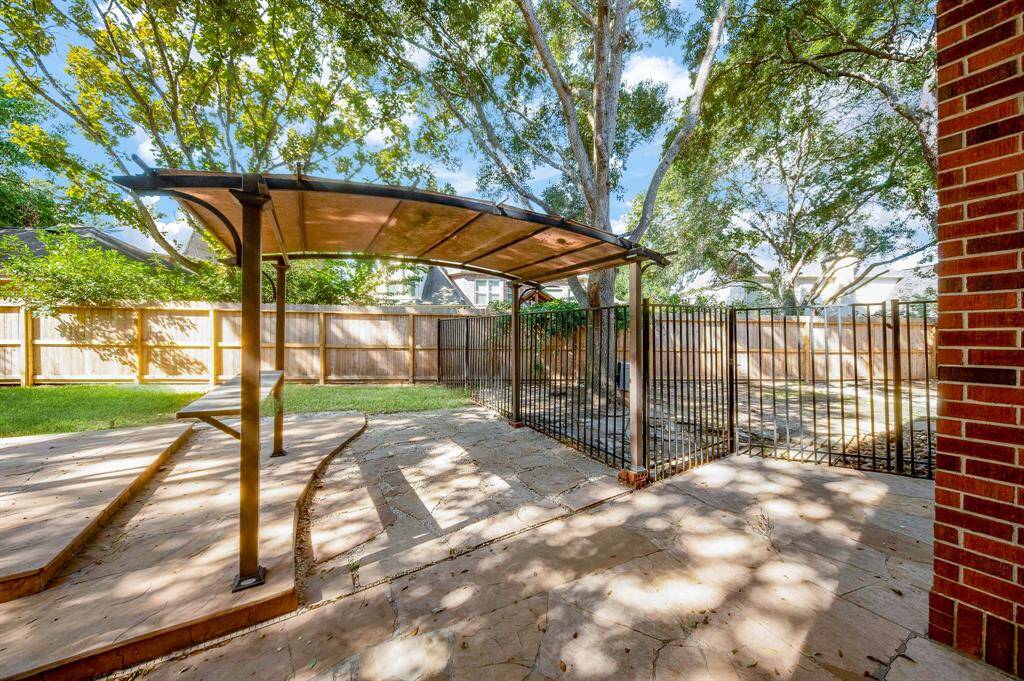 How lovely! A delicate pergola covers a gathering spot!