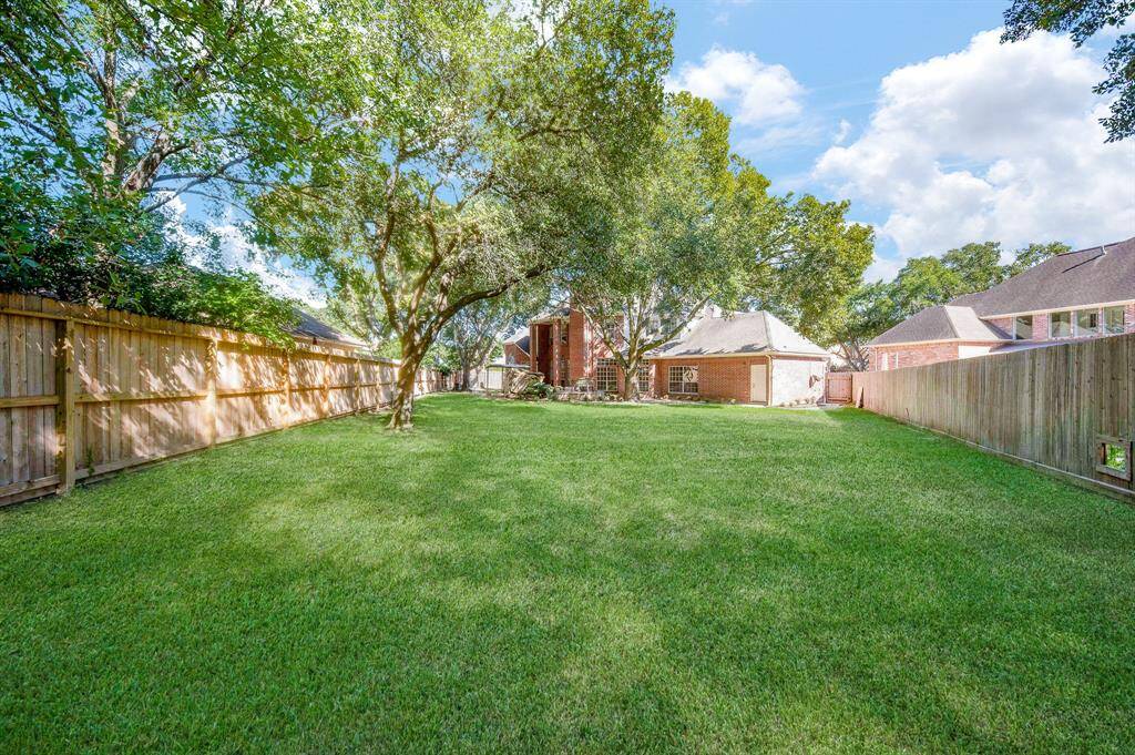 Your home is enclosed by privacy fencing and rich green carpeting!