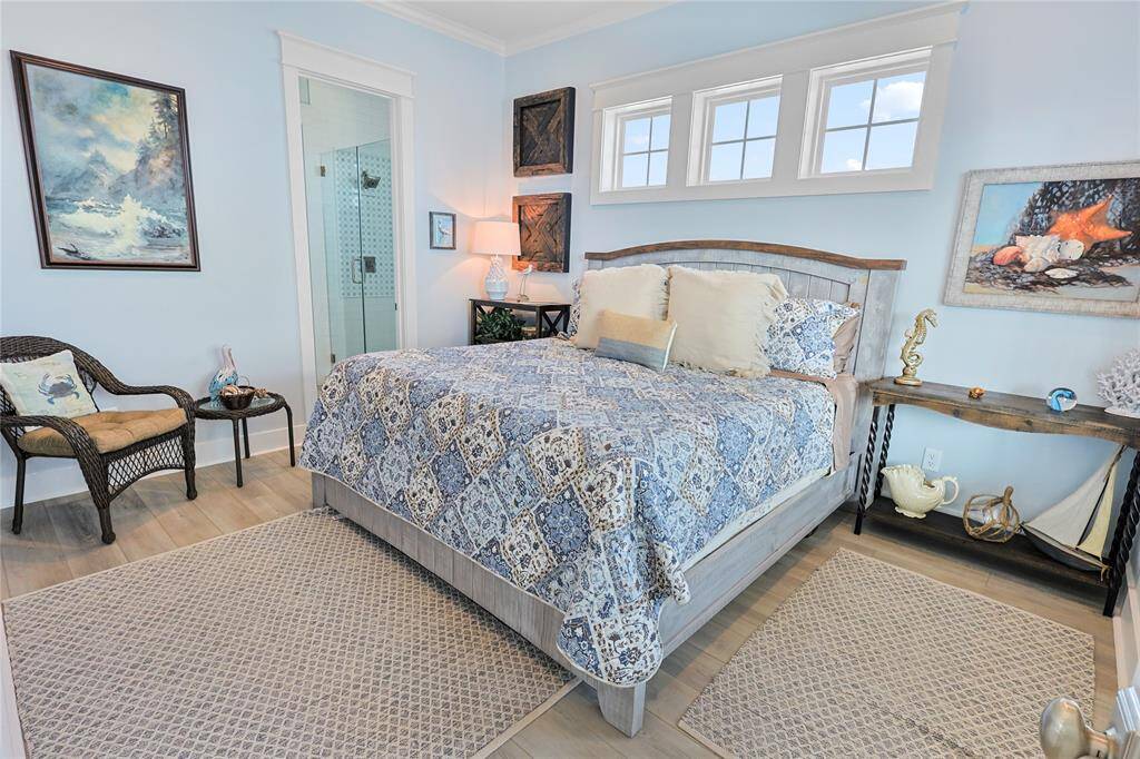 The first-floor primary suite is a serene retreat, featuring a spa-like ensuite with luxurious finishes, a spacious layout, and a tranquil ambiance for ultimate relaxation.