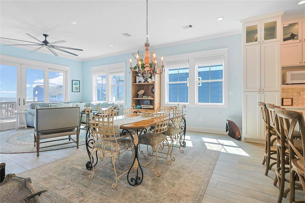 Take in the thoughtful fixtures and bask in the natural light from the expansive windows and sliding glass doors to showcase the beautiful gulf views.