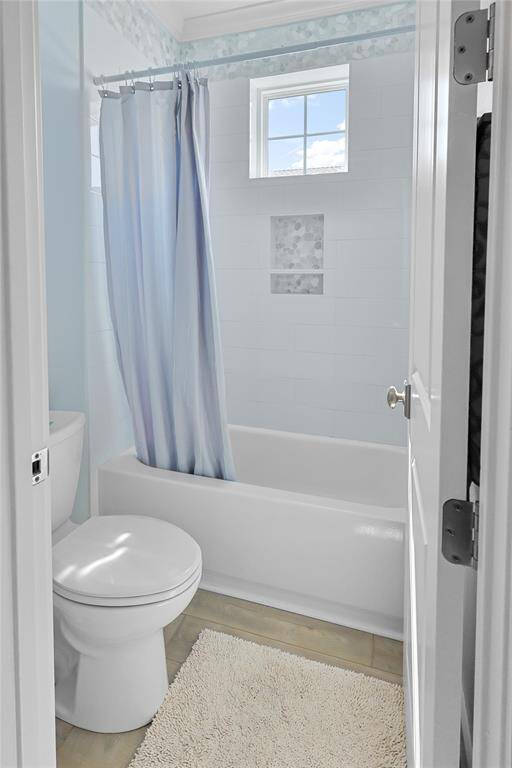 The full upstairs bathroom features a private water closet separate from the vanity area for added convenience.
