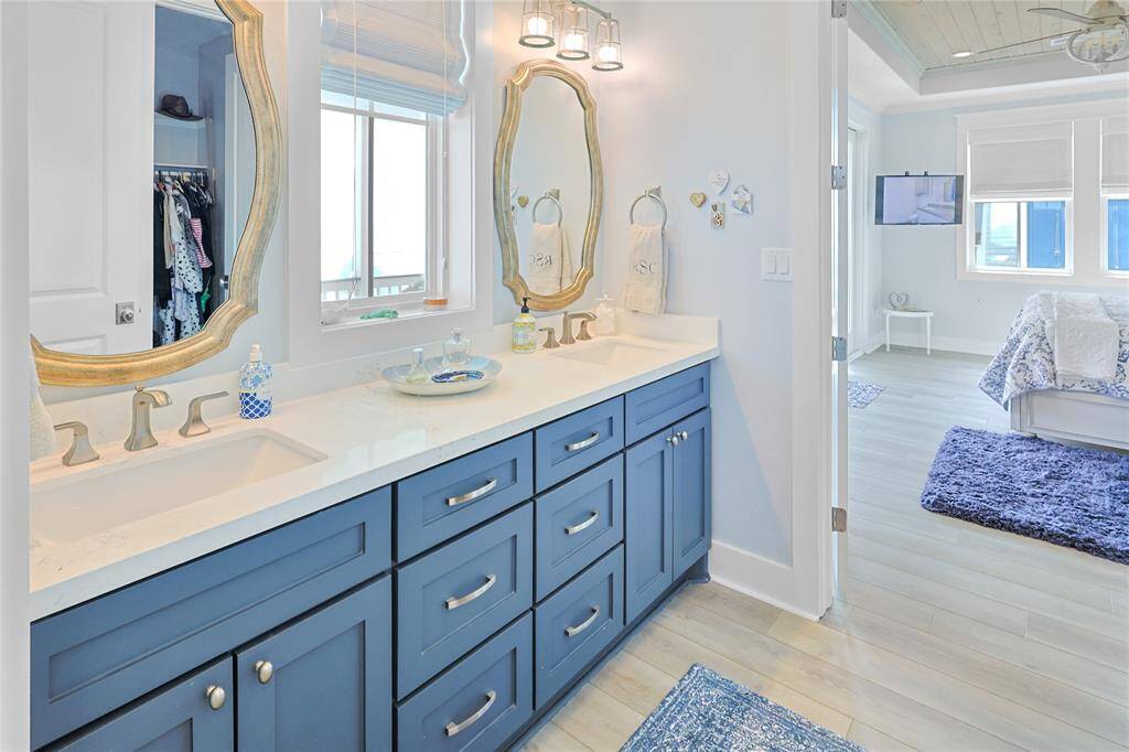 The primary ensuite offers ample storage with beautifully crafted soft-close cabinets, finished in designer paint for a sleek and sophisticated touch. Every detail is designed for both style and functionality.