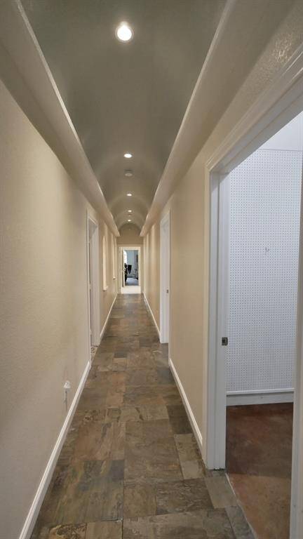 Hallway off the Kitchen leading to the Media Room, Bedrooms, and Laundry Room