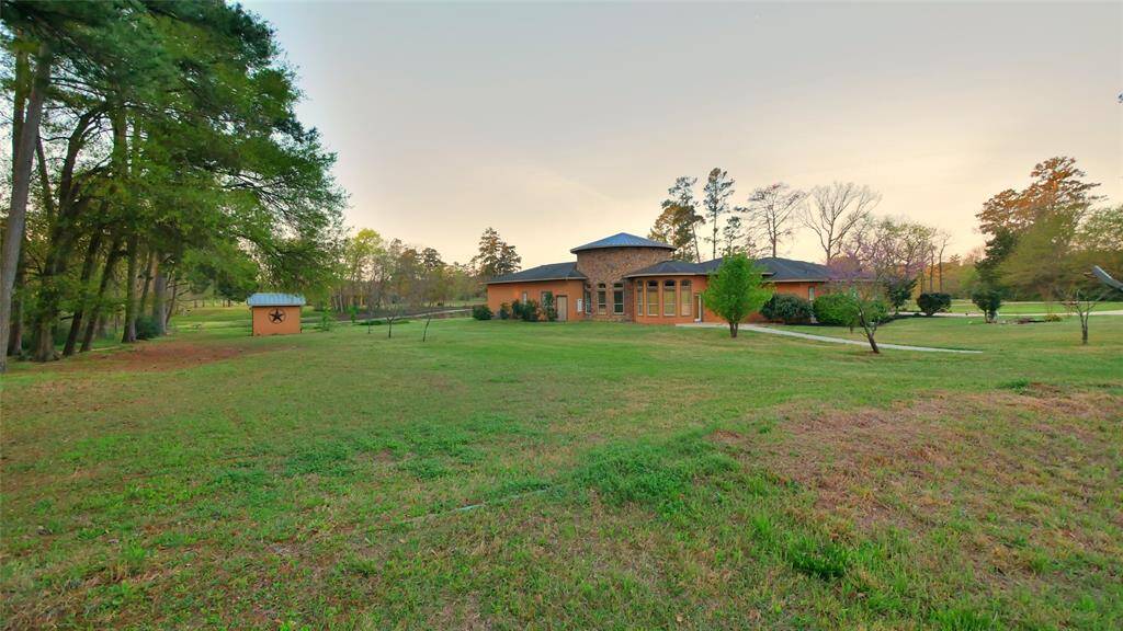 view from the hill to the back of the main house