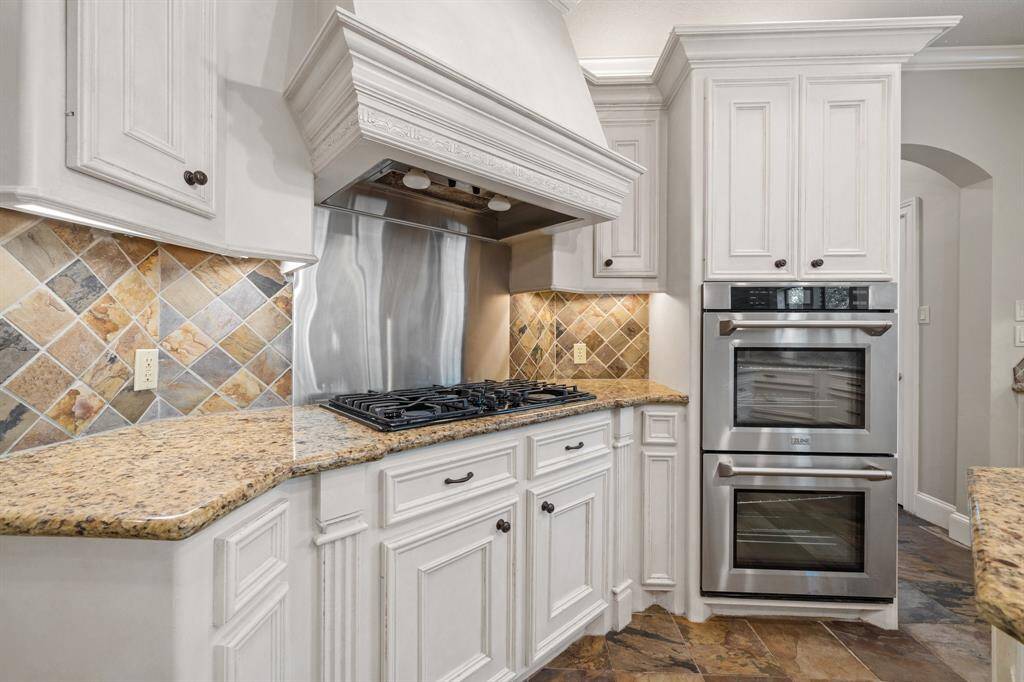 Sleek stainless steel appliances and a convenient double oven that makes cooking for family and guests effortless.