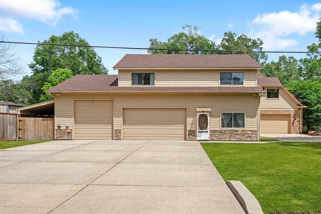 The ample garage provides a clean and discreet appearance. It's tucked alongside the home, maintaining the elegance of the front facade.
