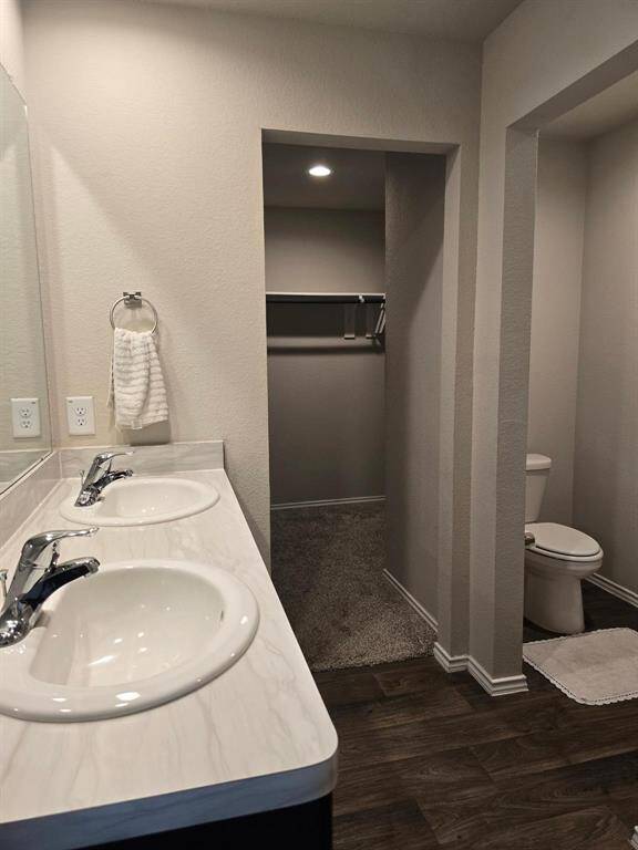 Primary bathroom overview. Walk-in closet.