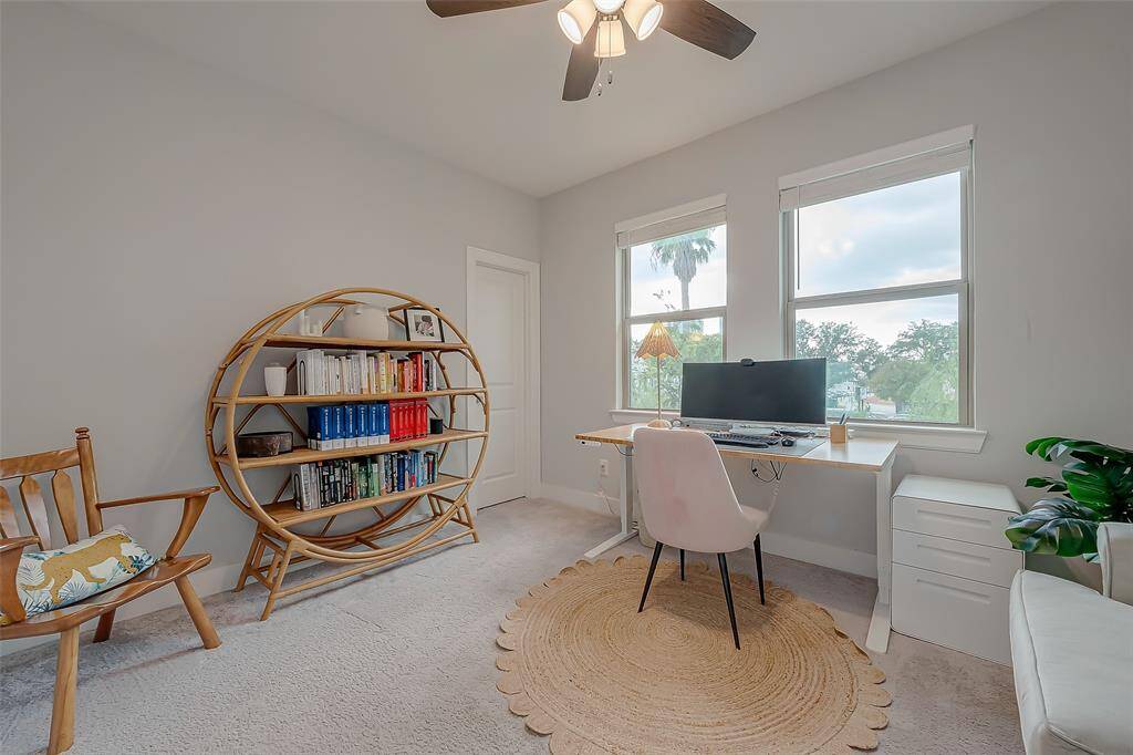 This bedroom is currently used as an Office. High ceilings with a walk-in closet.