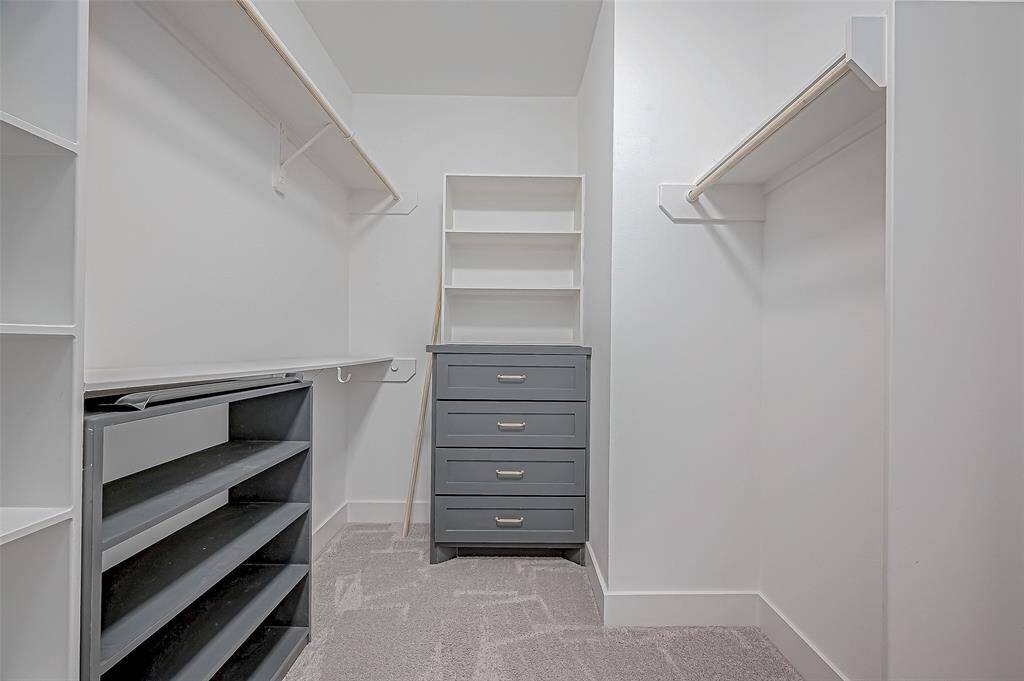 Another view of one of 2  walk-in closets in Primary