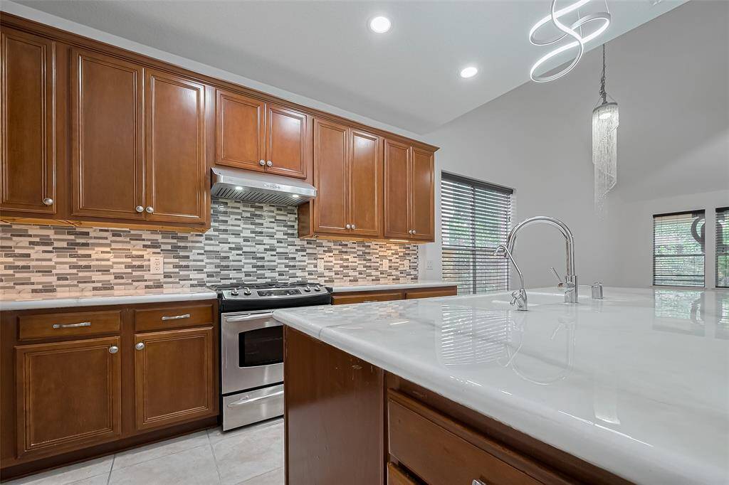 Modern stainless steel appliances make cooking and cleaning effortless.