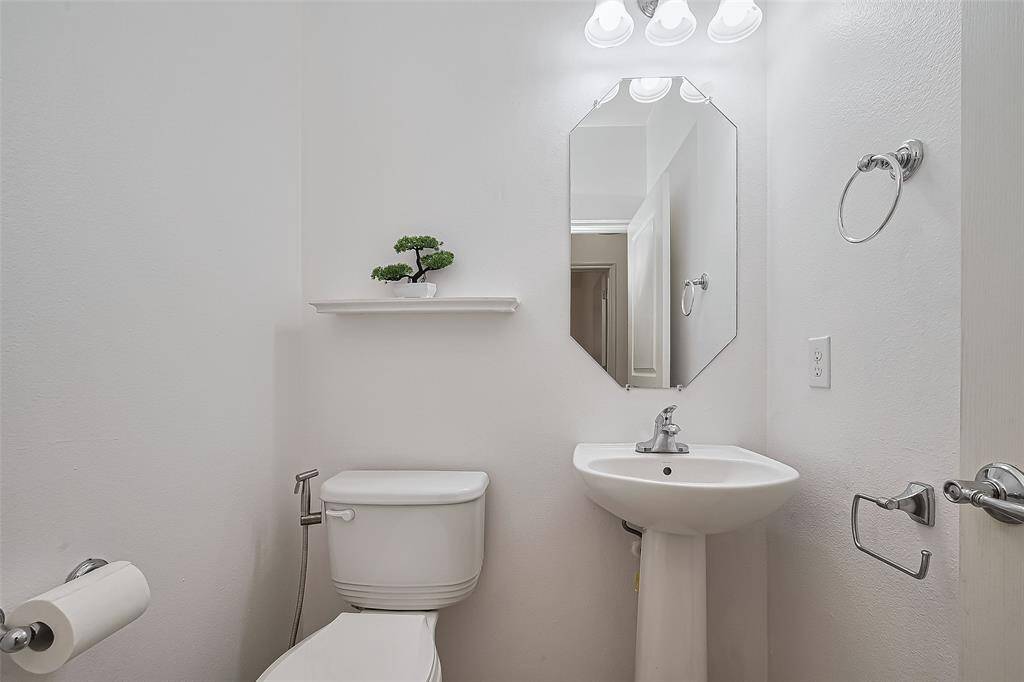 Conveniently located half bath is just steps from the living room.