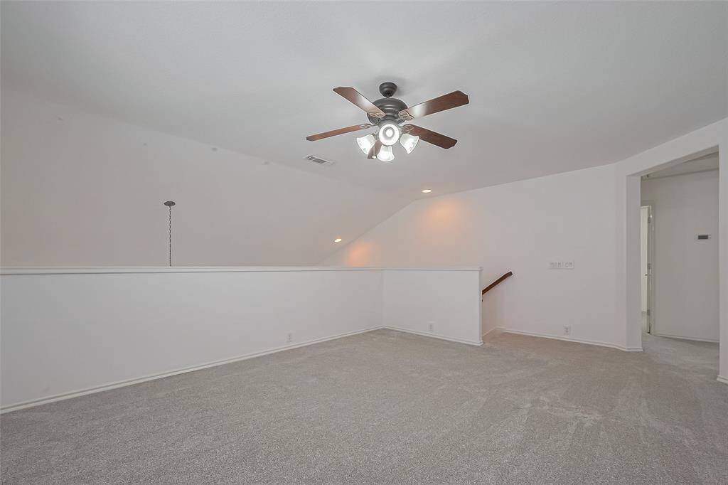 Discover a spacious game room upstairs, perfect for kid's play and relaxation.
