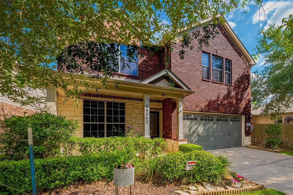 Beautiful landscaping add to the charm of the home.