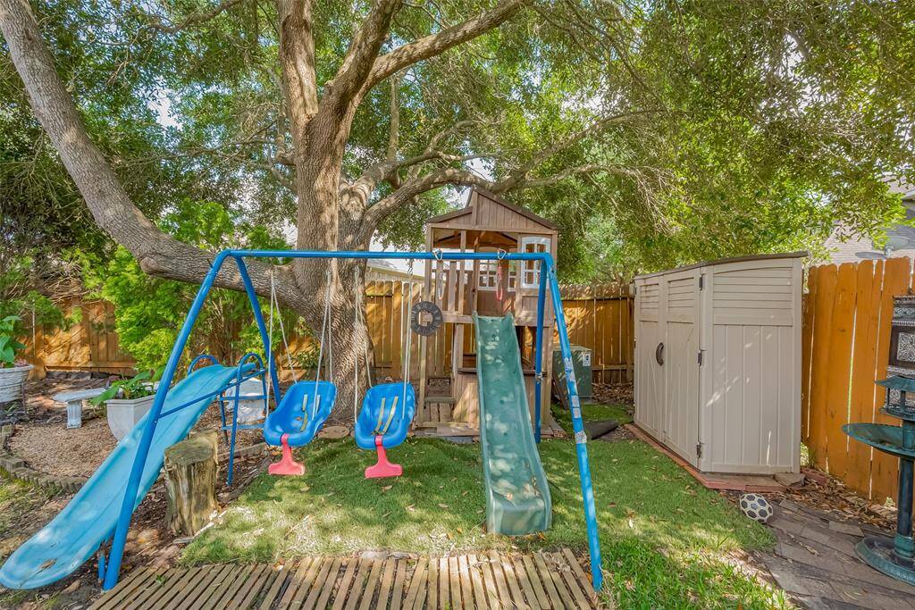 Enjoy endless fun with this charming backyard playhouse, perfect for your family's adventures right at home.