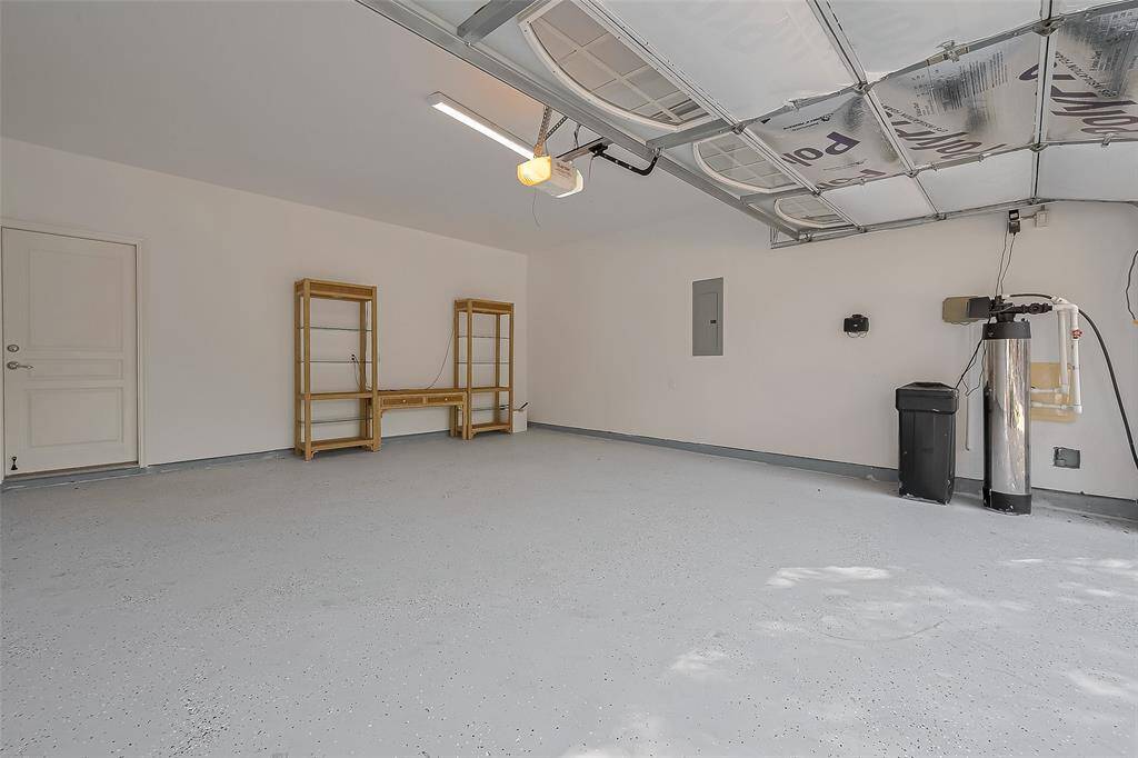Conveniently located in the garage are the water softener and sprinkler system controls.