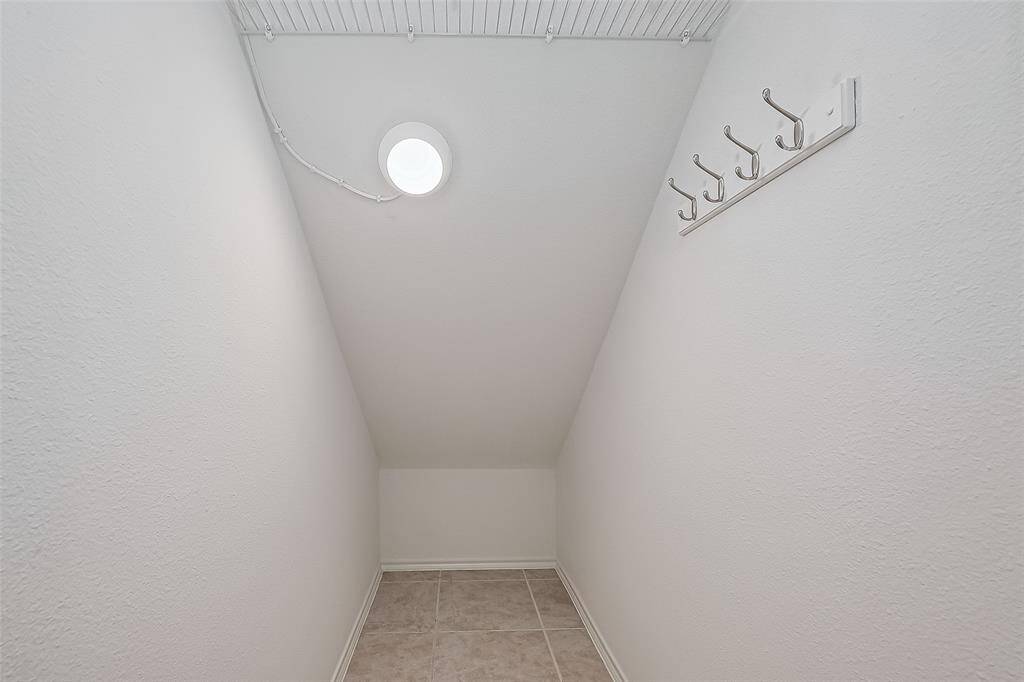 Efficiently illuminated under-stair storage offers a tidy solution for organizing your essentials.