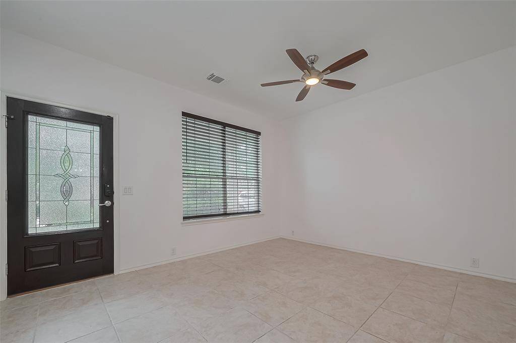 Experience a welcoming atmosphere in this spacious front dining room.