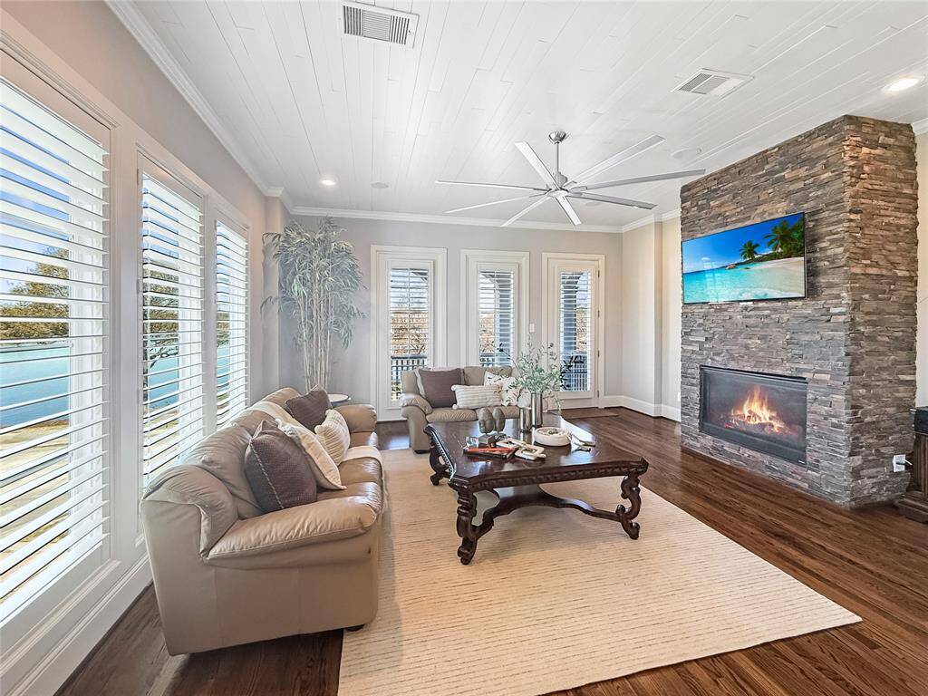 Stunning details throughout this home make it truly exceptional. Oversized windows flood the family room with natural light, highlighting the cozy fireplace.