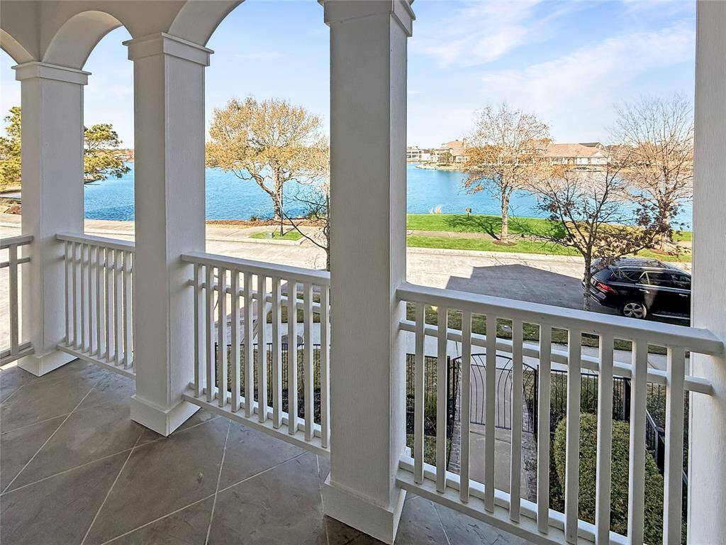 Enjoy breathtaking views from the second-floor balcony! This private space overlooks Lake Woodlands, perfect for savoring your morning coffee or unwinding with an evening cocktail.
