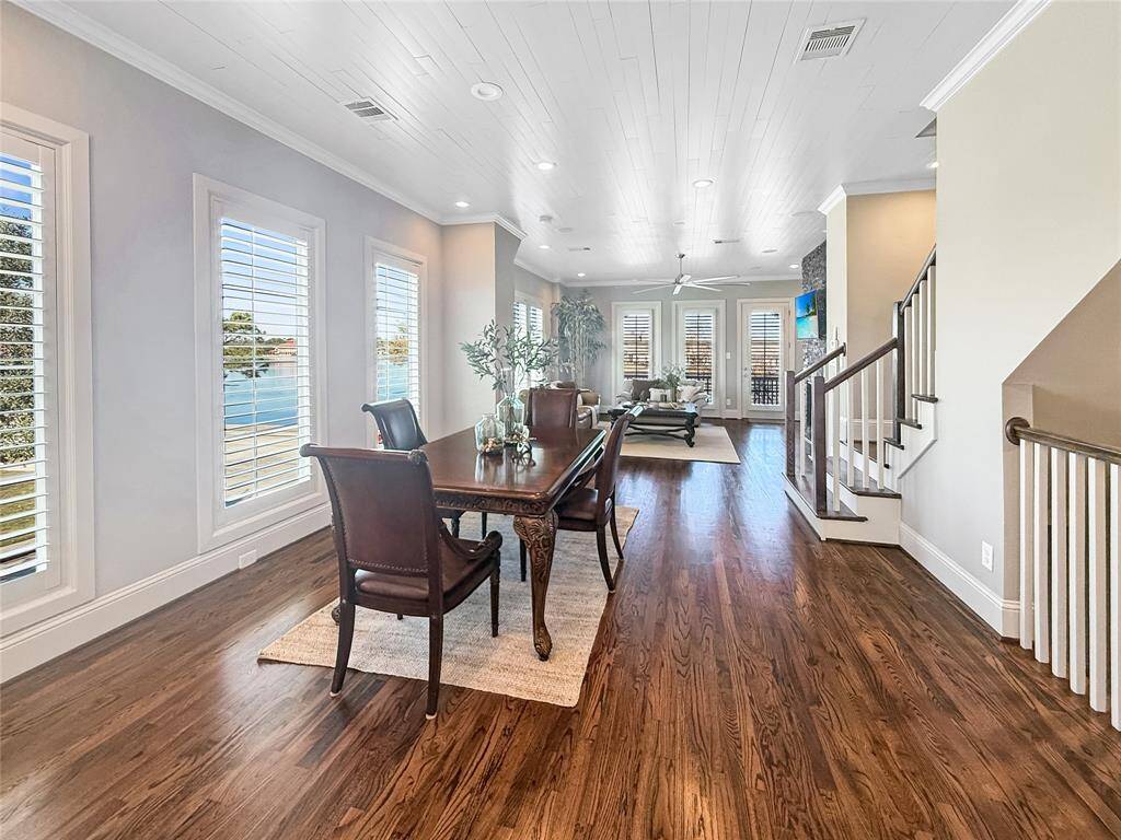 The kitchen flows into the dining and family rooms w/fireplace