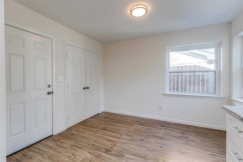 Bright and inviting bedroom featuring brand-new windows that fill the space with natural light, plus an en suite closet for your convenience