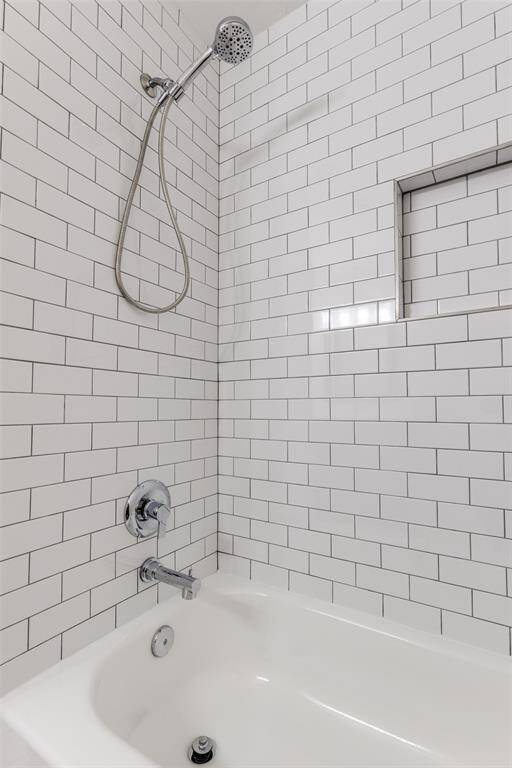 But wait, there's more! The secondary bathroom features matching colors and a renovated shower, ensuring your guests or family have a stylish space to enjoy