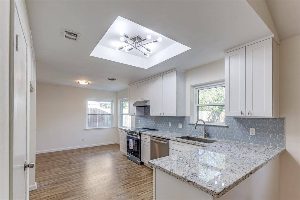 The kitchen has been thoughtfully opened up, providing the chef with plenty of space to create culinary masterpieces