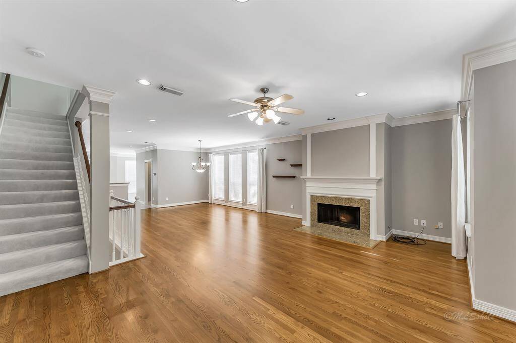 Your favorite artwork will make a stunning statement over the fireplace accentuated with the recessed lighting. The staircase takes you to the master suite and media room located on the third floor.