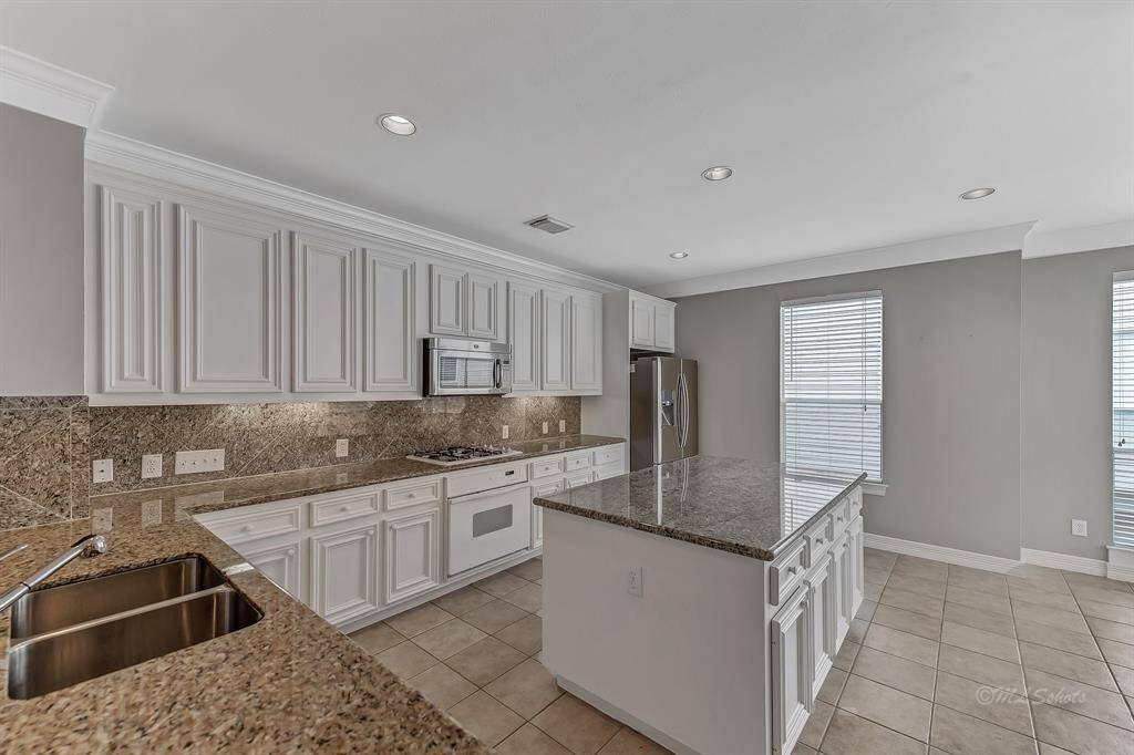 The spacious kitchen is sure to please for meal preparation, casual gatherings, lifestyle, and entertaining.
