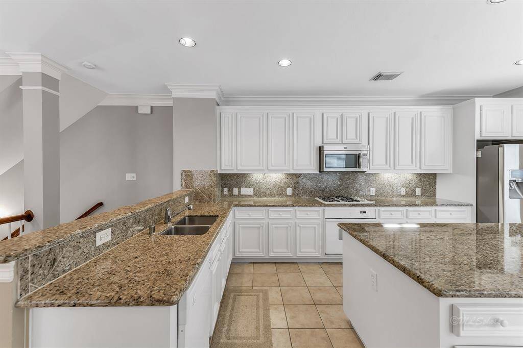 This stunning kitchen is loaded with storage!  You won't run out of room for all of your favorite appliances, serving pieces, and dishes!