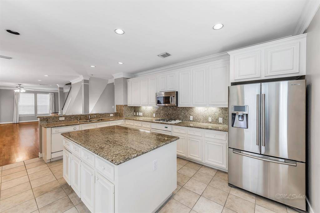 Flex your culinary muscles in this gourmet's dream kitchen!! The island is @ 6' x 3'8" and features additional cabinets for all your culinary needs.  The kitchen also features a walk in pantry, recessed lighting, and stainless steel double undermount sink.