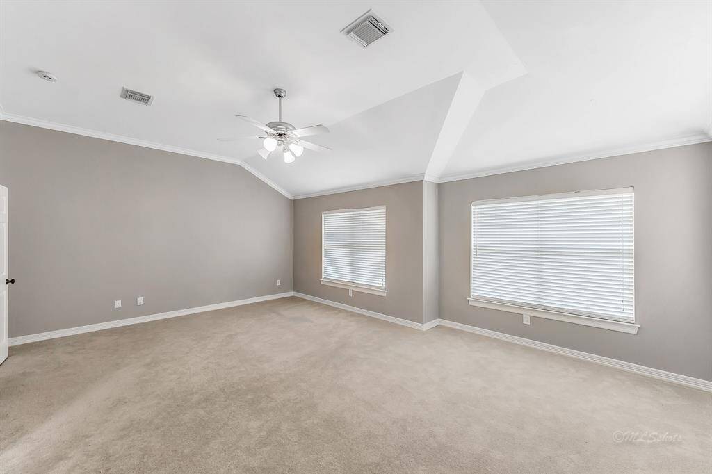Expansive windows fill the room with natural light.