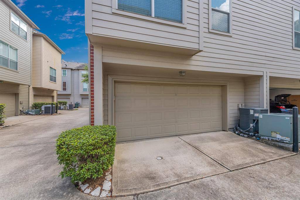 Two car garage located on the back of the home features @ 4' x 9' additional storage area! Overhead shelving and cabinetry provide even more space for your tools and holiday decor.