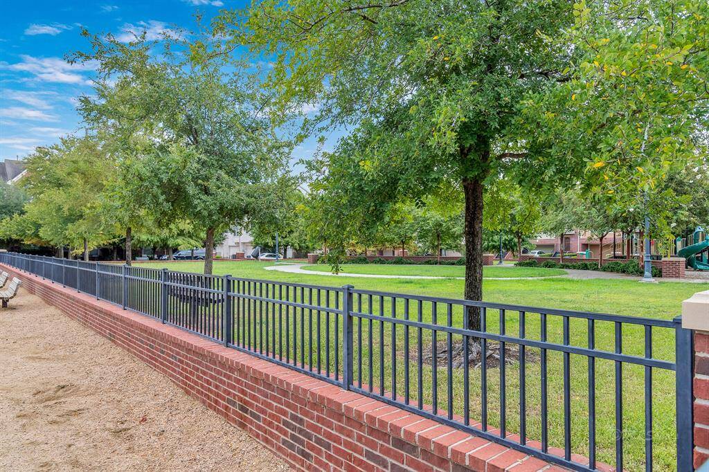 Charming paths and park benches are just outside the dog park.