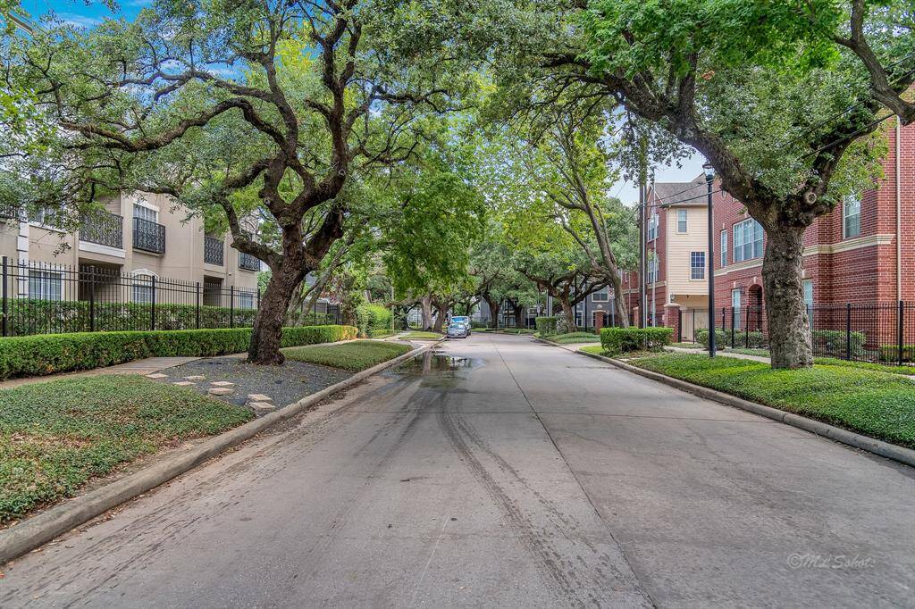 The community is lined with mature trees, sidewalks, and lots of parking along the property. Enjoy the shade from the trees as you walk to dining & shopping in the area.