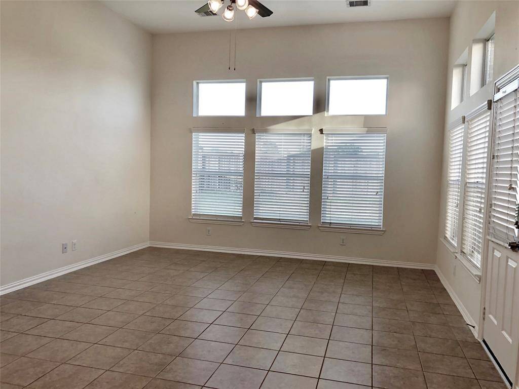 Living room with high ceilings and plenty of windows to add natural light. (Previous photo for showing purposes)