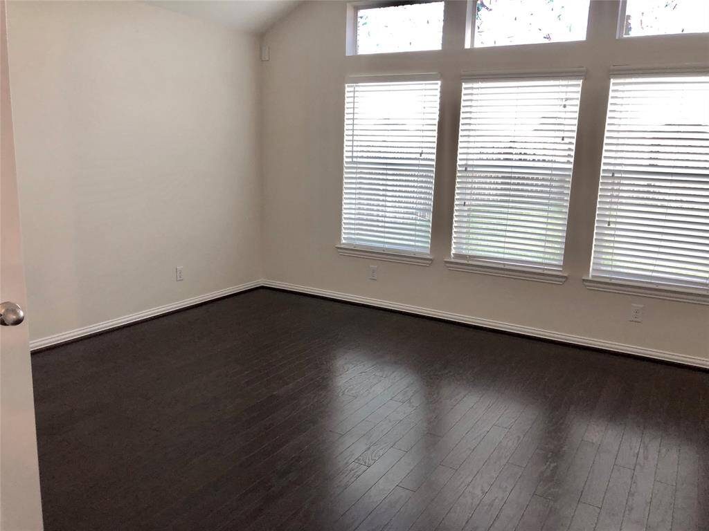 Primary bedroom with beautiful ceilings and wood floors. (previous photo for showing ourposes)