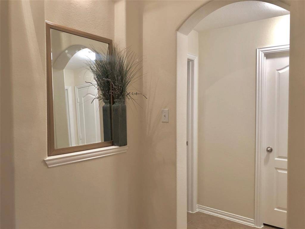 Entry hall to secondary bedrooms and secondary bathroom. Two additional closets for more storage area.