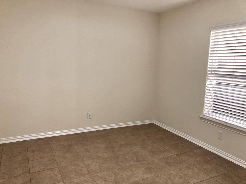 Secondary bedrooms with tile floorings. (previous photo)
