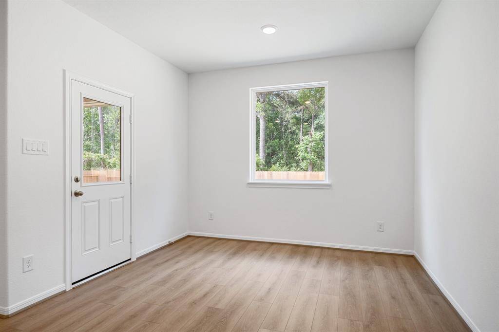 With an abundance of natural light streaming through the windows, the breakfast nook is bathed in a sunny glow, creating the perfect atmosphere to enjoy your morning coffee or a family breakfast.