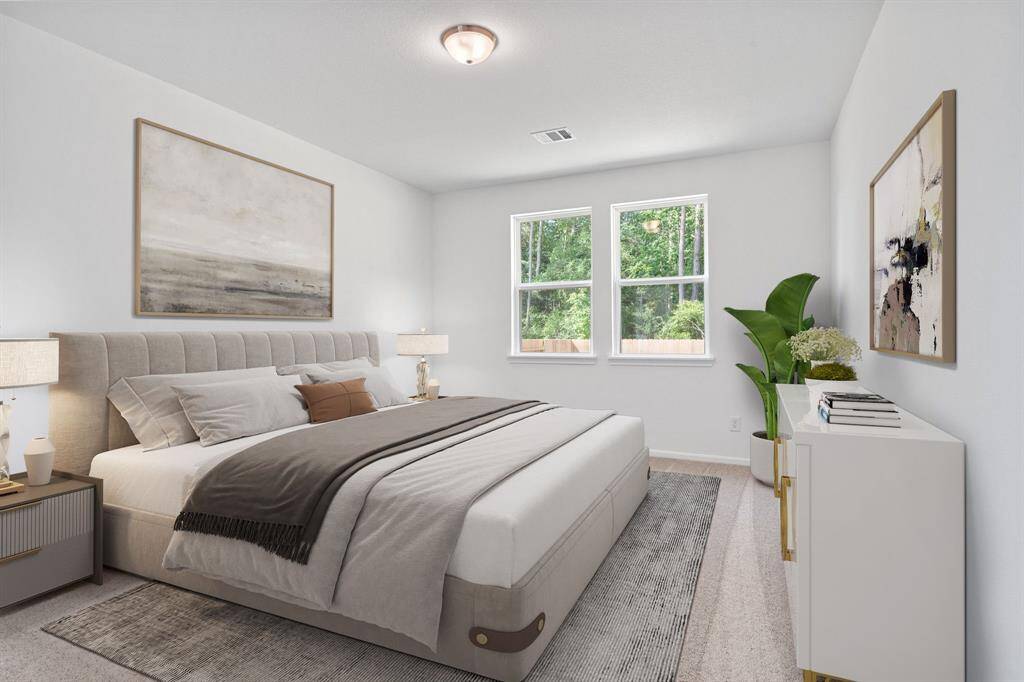 The primary bedroom is generously sized, creating a tranquil and spacious retreat that offers ample room for relaxation. Featuring plush carpet, high ceilings, fresh paint, and large windows that lets in natural lighting throughout the day.