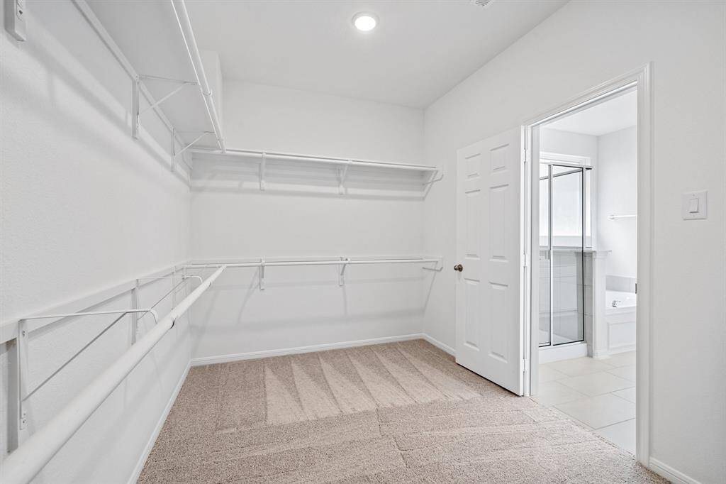A view of your large primary walk-in Closet