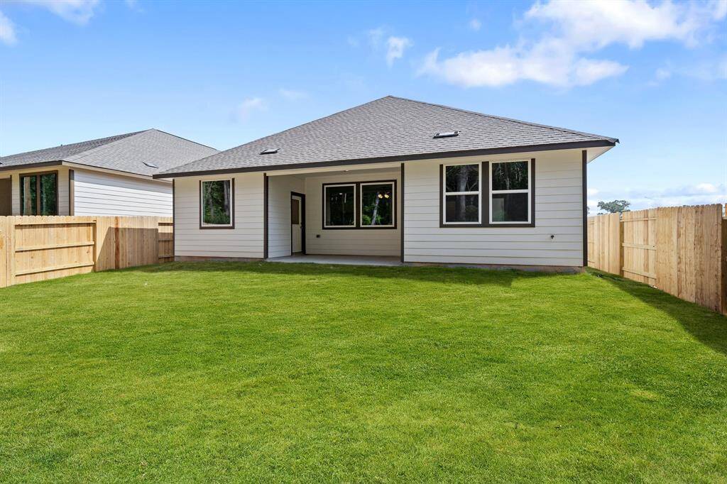 This backyard is perfect for family gatherings, social events, or simply unwinding in the fresh air.