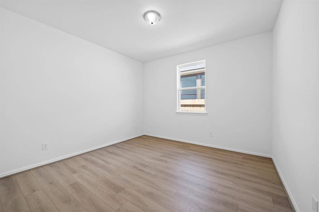 The home office features beautiful floors, large windows that give a fresh feel, this space promotes focus and creativity.