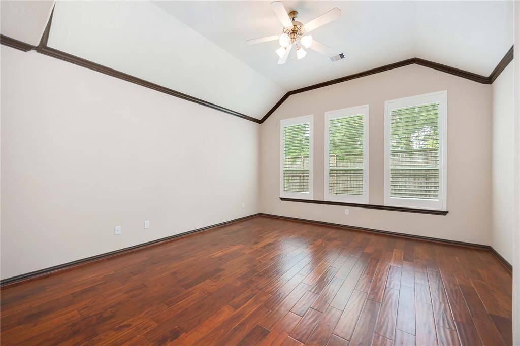 The first-floor primary suite overlooks the backyard and offers a tremendous amount of space.