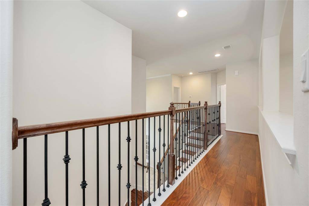 The wrought iron spindles are a nice touch to the banister upstairs.