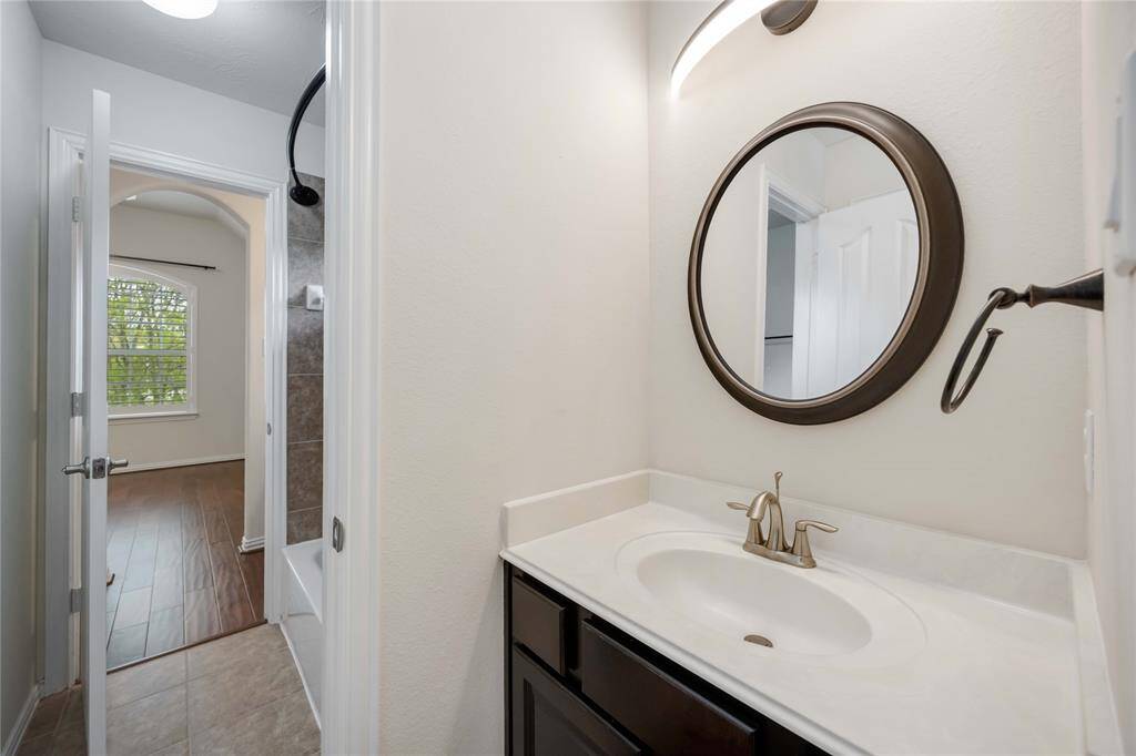 A 3rd full bath is a Jack and Jill bathroom that rests between two of the secondary bedrooms.